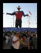 Everybody has to buy something. I pitched in to help carry Connie's brooms and shoes. Even Big Tex had a new shirt.